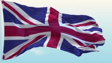 Britanya 'nın ulusal bayrağı mavi gökyüzüne doğru rüzgarda dalgalanıyor.