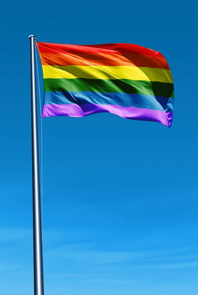 Rainbow flag waving on the wind — Stock Photo, Image