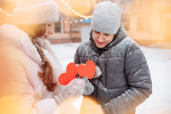 Young Loving Couple Winter Day Holding Red Paper Hearts Hands — Stock Photo, Image