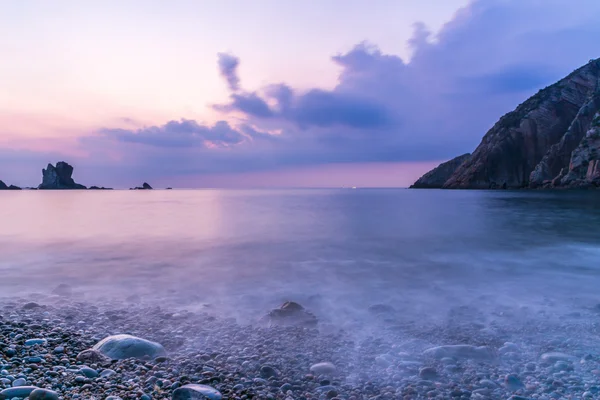 Long exposure of a beautiful sunset over the sea — Stock Photo, Image