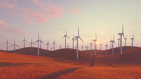 Wind turbines on red hills at sunset — Stock Photo, Image