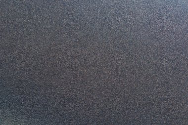 Bulanık siyah grunge desenli arka plan, sığ nokta, büyük tahıl. Tasarımcılar için soyut doku ve arkaplan