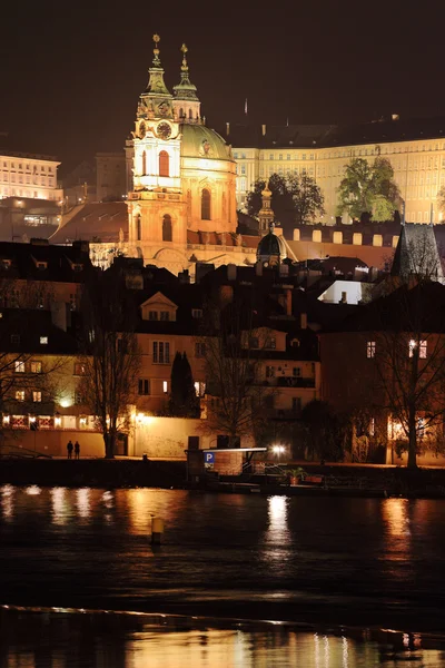 Night romantic snowy Prague St. Nicholas' Cathedral, Czech republic — Stock Photo, Image