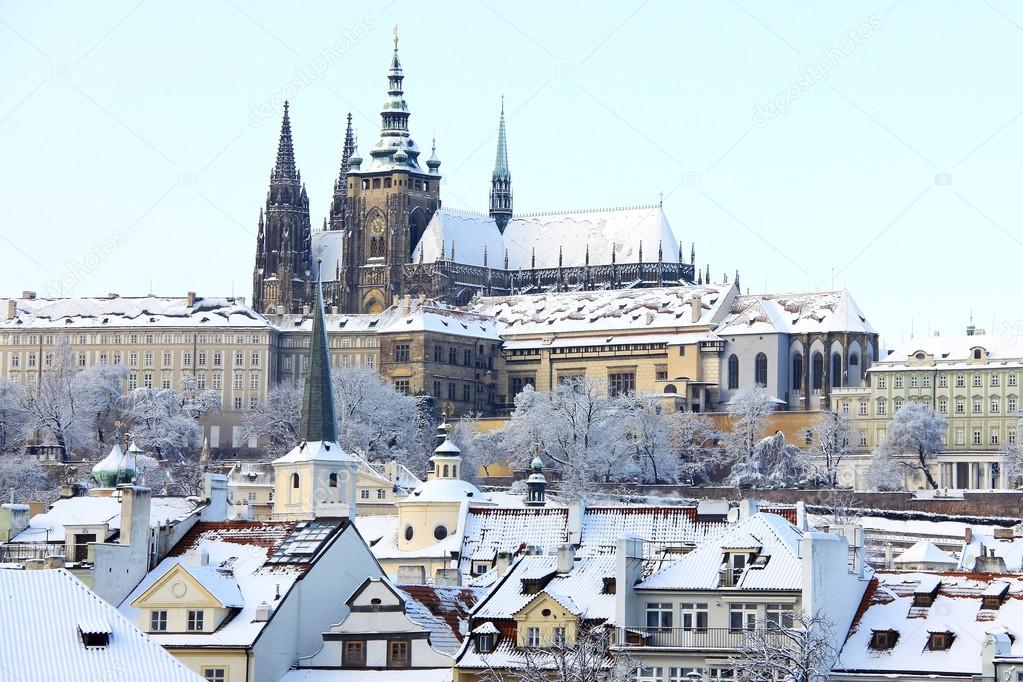 Romantic snowy Prague gothic Castle above River Vltava, Czech Republic