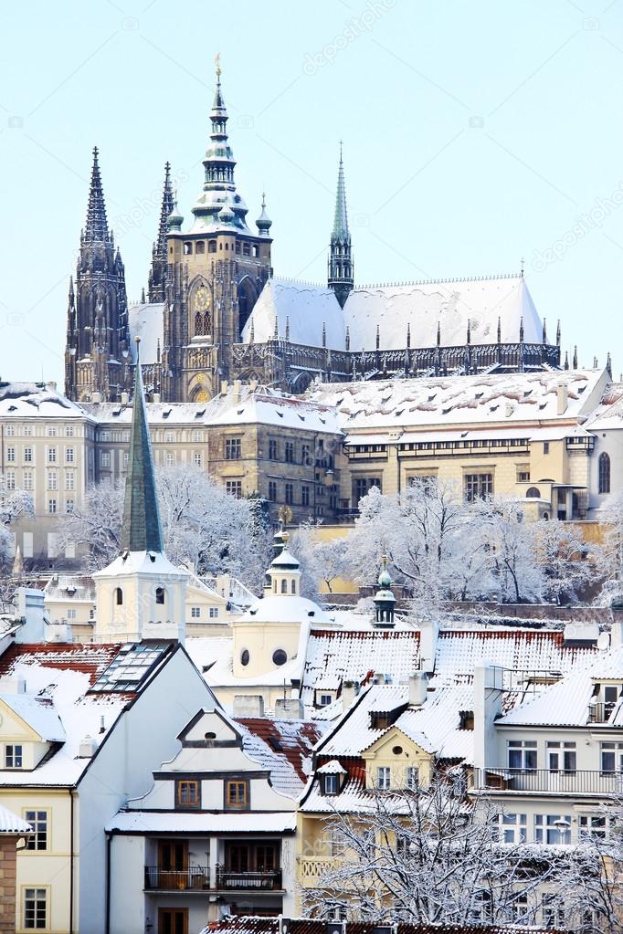 Romantic snowy Prague gothic Castle above River Vltava, Czech Republic