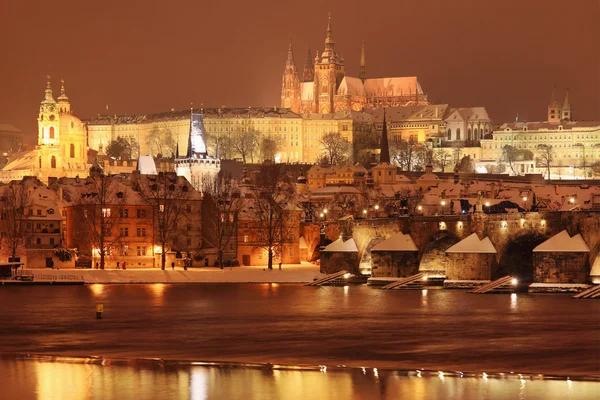 Night romantic colorful snowy Prague gothic Castle with Charles Bridge, Czech Republic — Stock Photo, Image