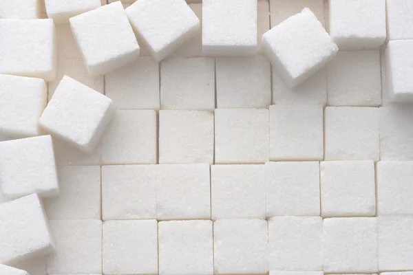 close up of white sugar cubes