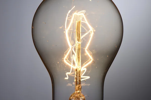 Close up vintage glowing light bulb — Stock Photo, Image