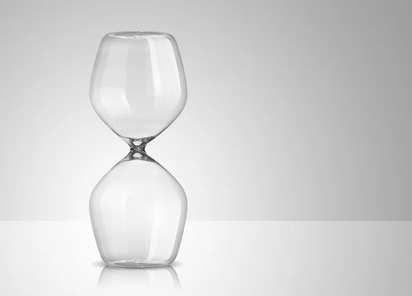 Empty hourglass on gray background — Stock Photo, Image