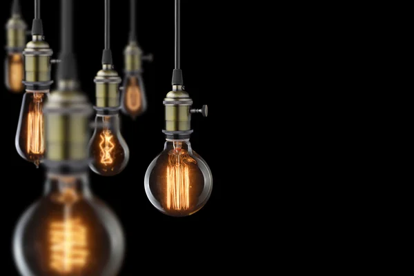 siyah arka plan üzerine Vintage parlayan ışık Ampüller