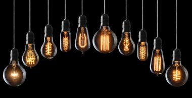 Set of vintage glowing light bulbs on black clipart