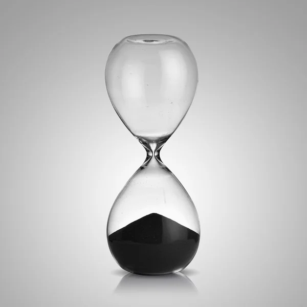 Hourglass on gray background — Stock Photo, Image