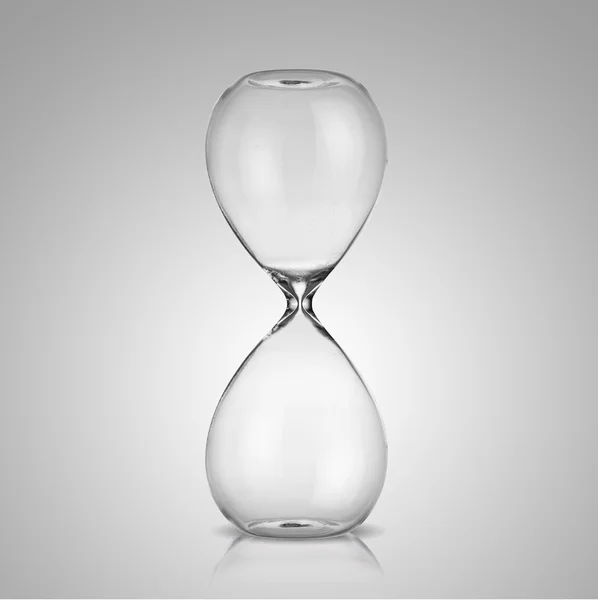 Empty hourglass on gray background — Stock Photo, Image