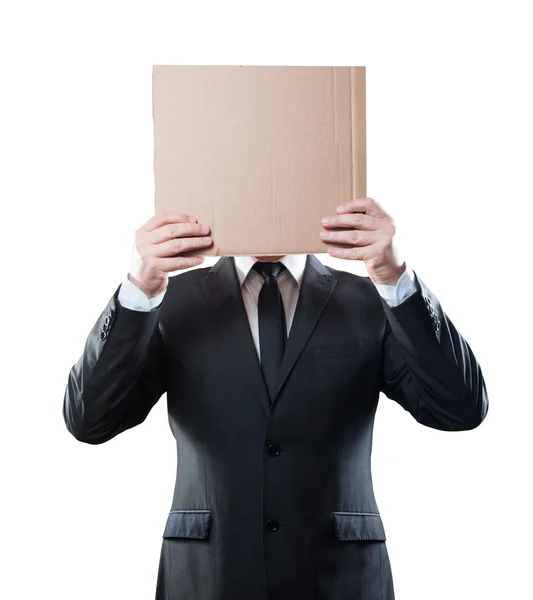 Businessman holding cardboard on white background. Clipping path — Stock Photo, Image