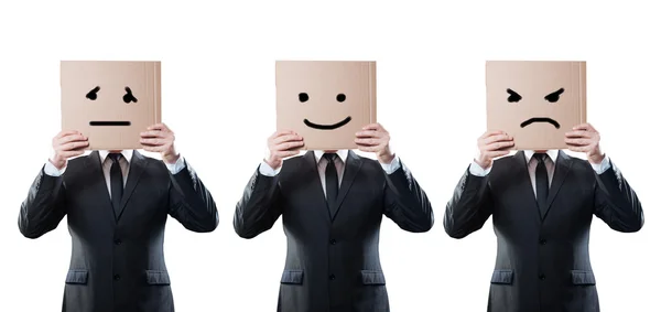 Hombres de negocios sosteniendo una tarjeta con la cara emocional en el fondo blanco — Foto de Stock