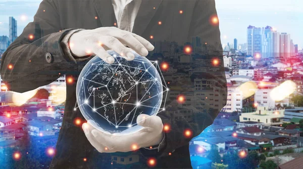 Hologram globes and networked connections in the hands of businessmen. communication network concept.