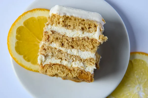 Piece Homemade Honey Cake Decorated Orange Slices White Background High — Stock Photo, Image