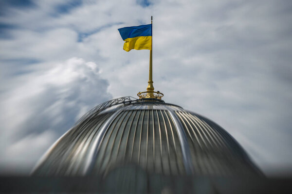 The Ukrainian flag flies above the dome of the parliament building on Ukraines Independence Day in Kyiv, Ukraine, August 24, 2025. High quality photo. Motion effect