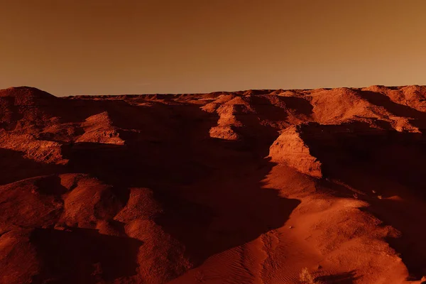 Fantastic martian landscape in rusty orange shades, Mars surface, Desert, Cliffs, sand. Alien landscape. Red planet mars.