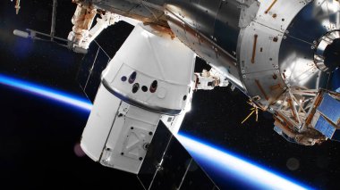 SpaceX mürettebat ejderha uzay aracı Uluslararası Uzay İstasyonu 'na yanaştı. Bu görüntünün elementleri NASA tarafından desteklenmektedir