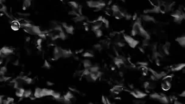 Splashes and drops on the surface of the liquid. Abstract Black Background Water vibration — Wideo stockowe