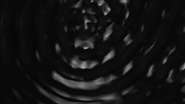 Splashes and drops on the surface of the liquid. Abstract Black Background Water vibration — Stok video