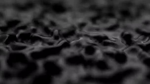 Splashes and drops on the surface of the liquid. Abstract Black Background Water vibration. 4K slow motion 100 fps, ProRes 422, 10 bit — Wideo stockowe