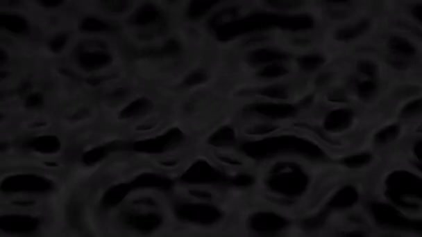 Splashes and drops on the surface of the liquid. Abstract Black Background Water vibration. 4K slow motion 100 fps, ProRes 422, 10 bit — Wideo stockowe