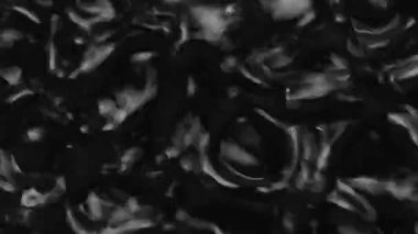 Splashes and drops on the surface of the liquid. Abstract Black Background Water vibration. 4K slow motion 100 fps, ProRes 422, 10 bit