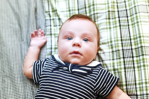 Newborn baby lying in bed — Stock Photo, Image