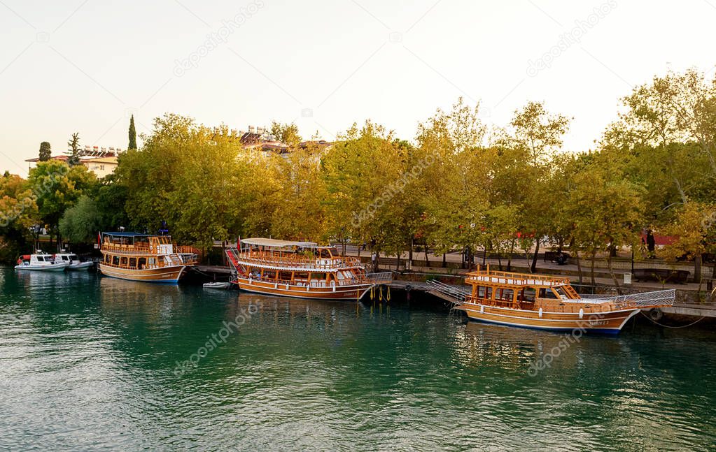 Walking vintage boats on the lake. Autumn location. Turkey, Manavgat.