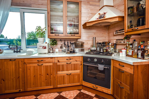 Wooden kitchen in a Russian country house. Country life during the pandemic