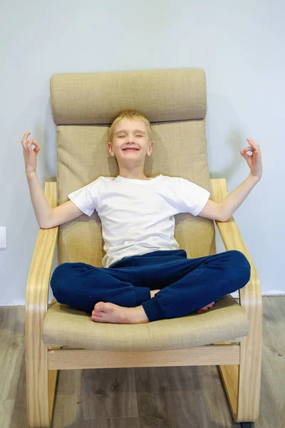 Little Boy Jokingly Meditating Lotus Position Chair — Stock Photo, Image