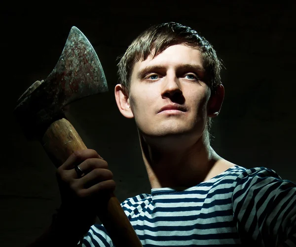 Portrait of a young man with an ax — Stock Photo, Image