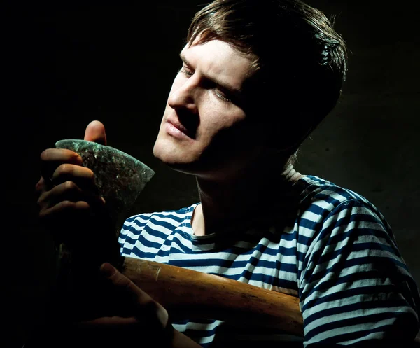 Portrait of a young man with an ax — Stock Photo, Image