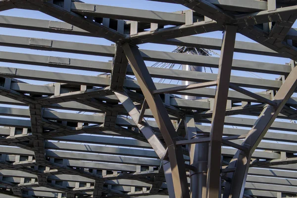 Pergola canopy, structural elements. An architectural structure of repeating arches to protect visitors from the sun. Renewed entrance lobby in Kiev on Trukhanov Island after reconstruction