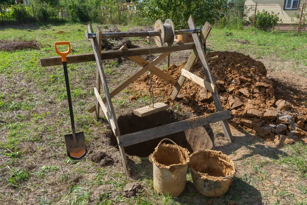 Digging a deep well in the ground — Stock Image Digging a deep well in the ground Stock Photo