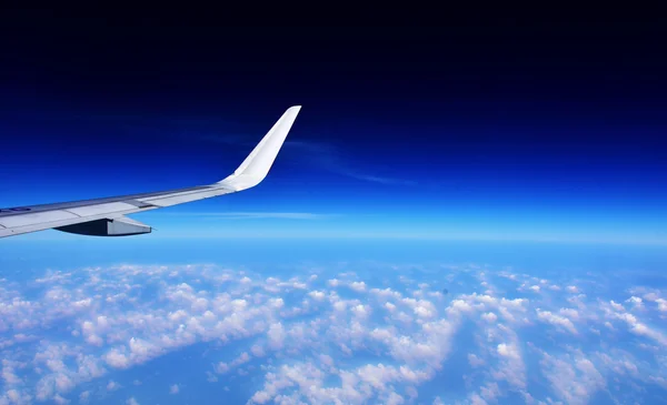 aircraft wing and cloud view from window