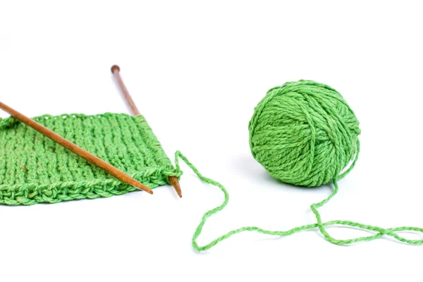 Green yarn and knitting — Stock Photo, Image