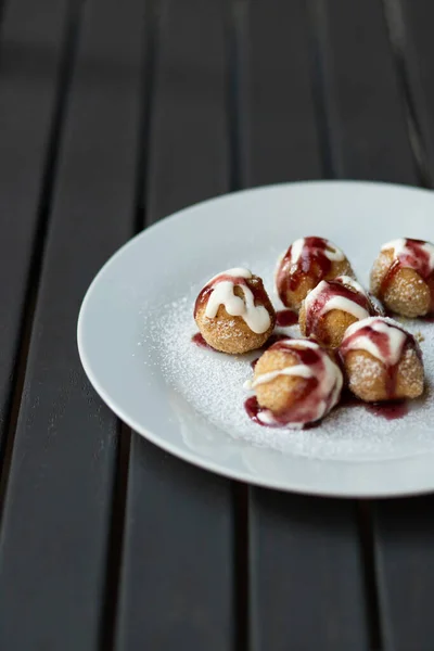 stock image homemade cottage cheese donuts balls with powdered sugar, sour and marmelade