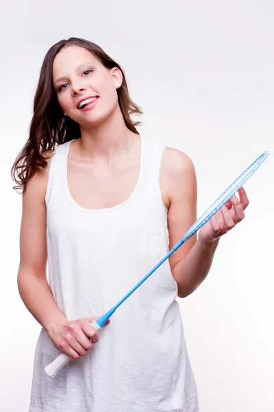 Menina segurando badminton raquete — Fotografia de Stock