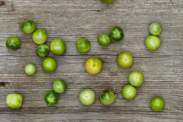 Tomatoes on wooden background — Stock Photo, Image