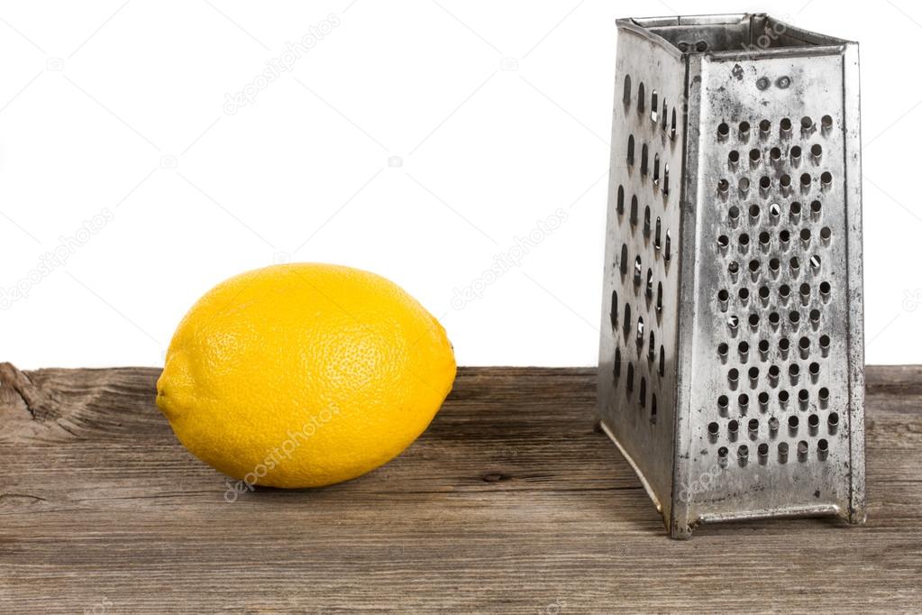 old cheese grater and lemon