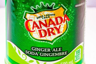 Calgary, Alberta, Canada. Nov 15, 2020. Close up to a Canada Dry Ginger Ale green bottle soda.