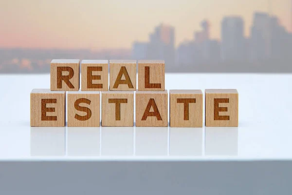 Real Estate Message Sign Wooden Blocks Sitting White Table — Stock Photo, Image