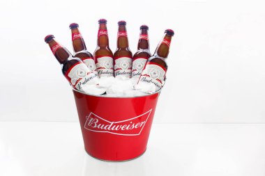 Calgary Alberta, Canada. April 02, 2021. A Budweiser Beer Bucket American-style pale lager with six beer bottles with ice on a white background. clipart