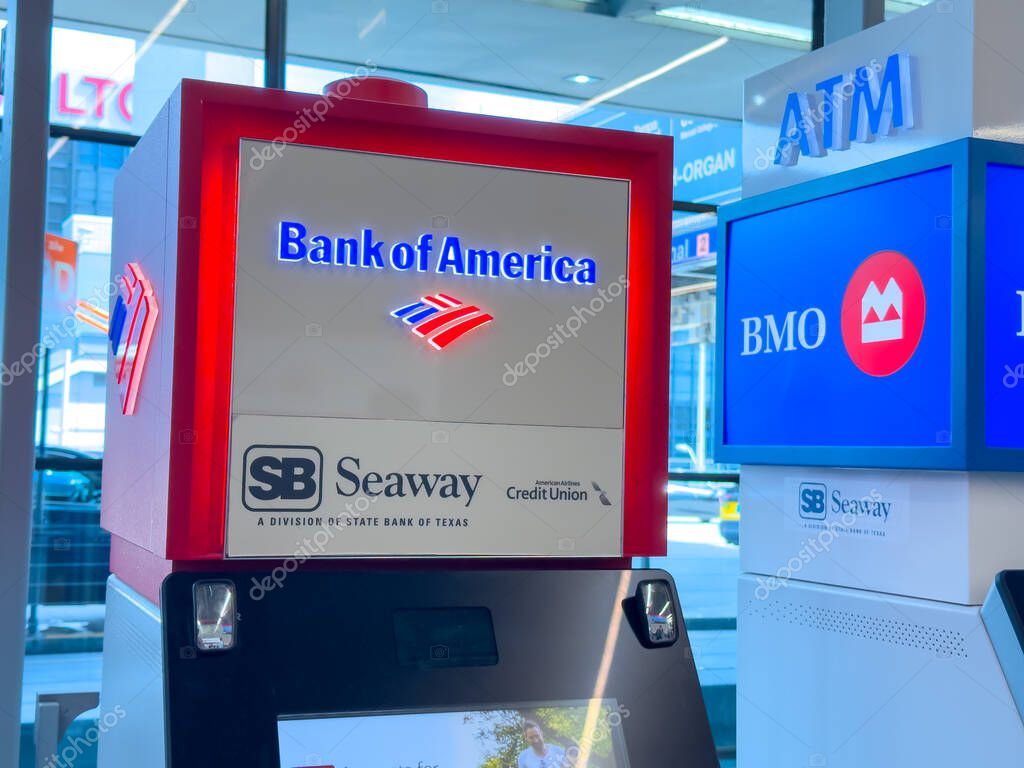 Chicago, Illinois, USA. Oct 11, 2025. A vibrant red and white Bank of America sign stands prominently, with a BMO ATM visible nearby, showcasing banking services.