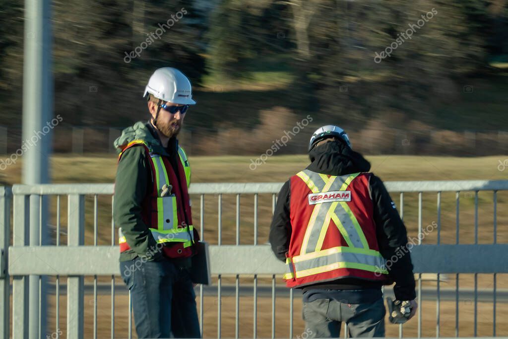 Calgary, Alberta, Canada. Nov1, 2025. Black modified Toyota Tacoma parked on a suburban street with winch bumper, snorkel, roof rack and large offroad tires