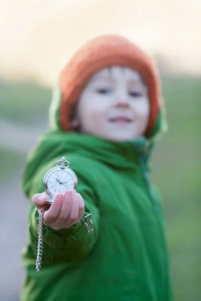 Cute preschool boy, holding pocket watch — Stock Photo, Image