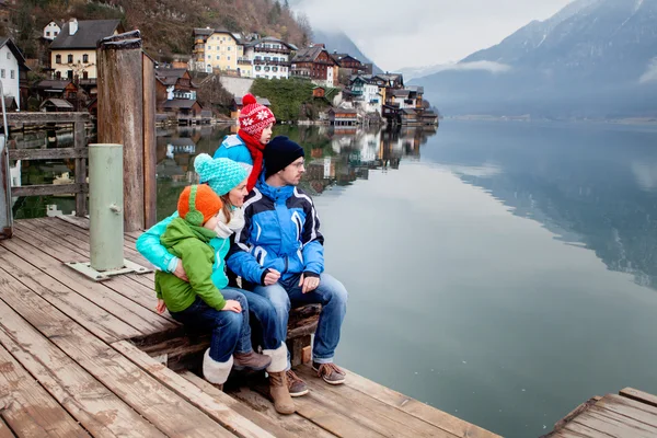 Happy beautiful family with two small children, exploring and en